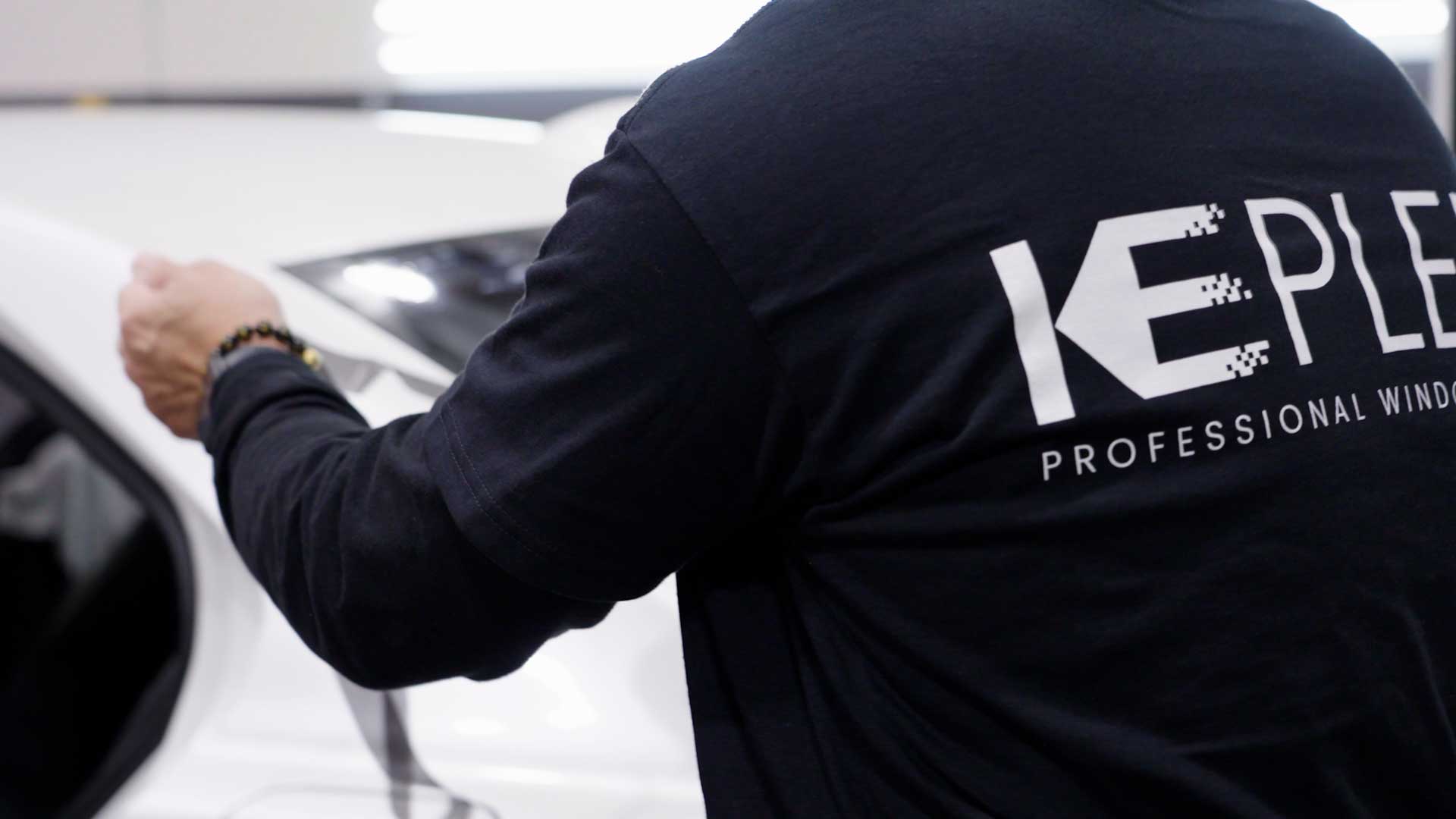 Window Tinting Specialist Cutting Film in Depew, New York