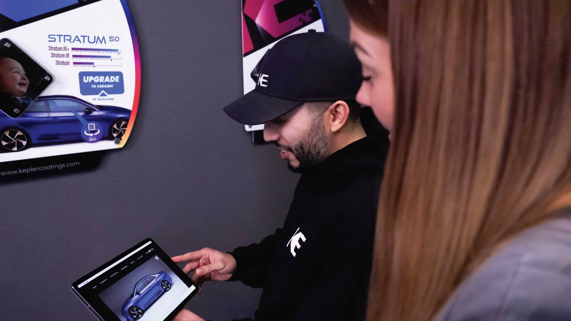 Kepler Dealer Showing Window Film Options to Customer in Panama City, Florida